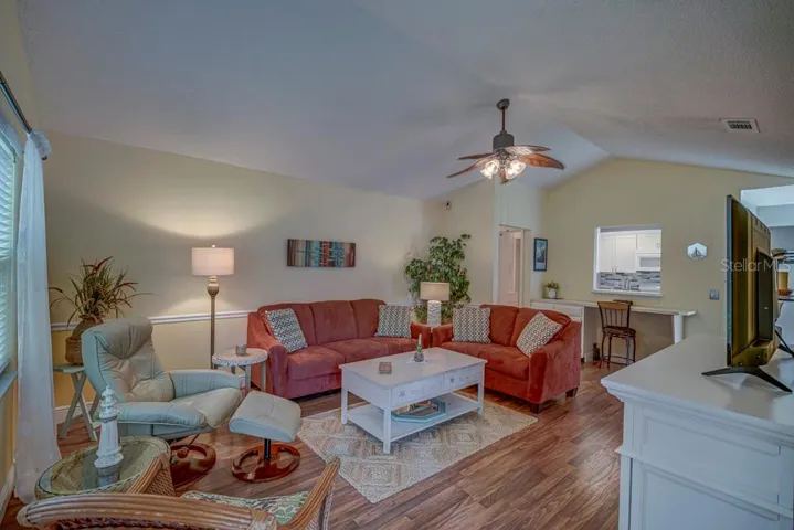 Living room with vaulted ceiling laminate flooring
