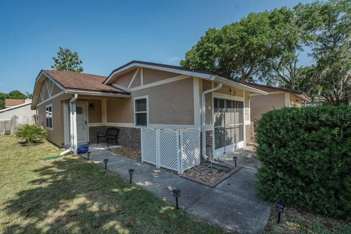 Sidewalk to covered front porch and side yard