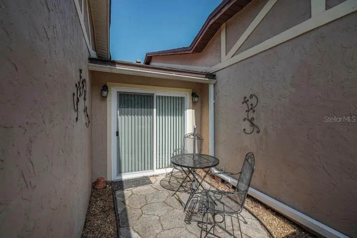 Front courtyard with sliders into Dinette