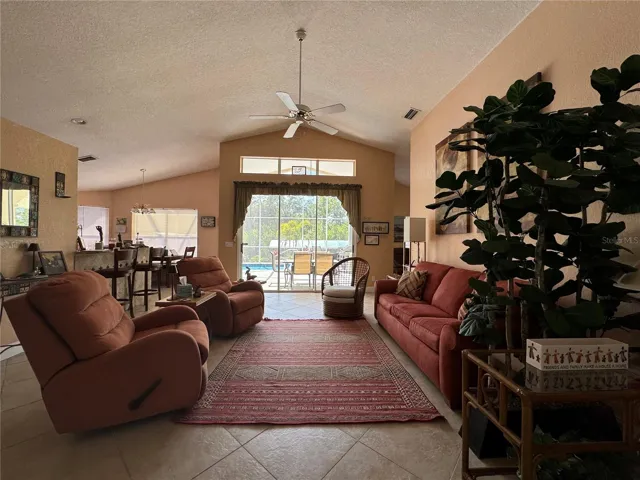 Expansive Great Room with High Ceilings and  Sliders to the pool area