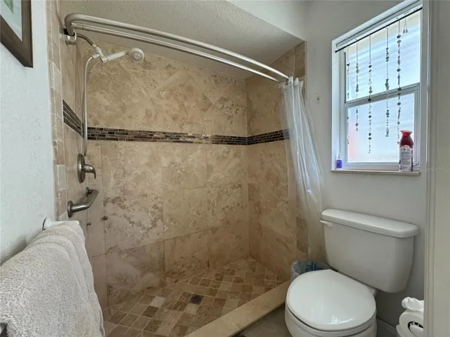 master bathroom shower w. travertin tile