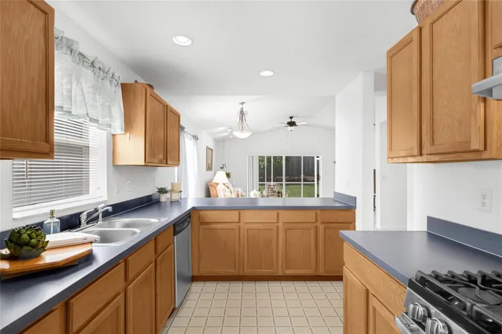 Kitchen features oak cabinetry