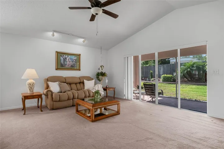 Vaulted ceilings and an oversized glass sliding door