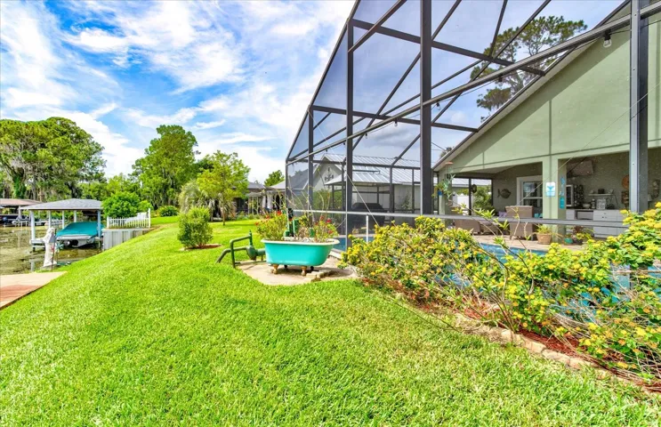 Back yard and butterfly Garden with tub and Irrigation pump from canal.
