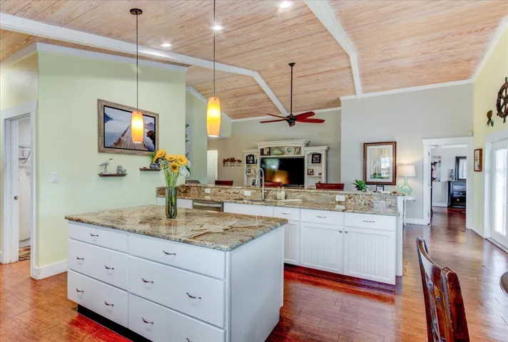 Look at this Kitchen!!!! Storage space galore, soft close drawers and cabinets, stunning Granite counter tops, and Ceramic Tile (looks like) wood floors throughout the home. NO CARPET!
