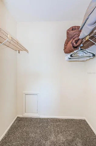 Primary bedroom walk-in closet
