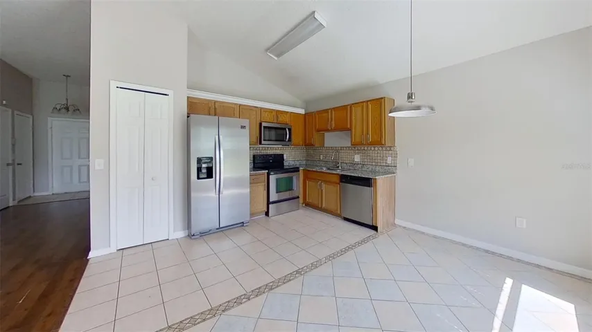 View of breakfast nook and kitchen.