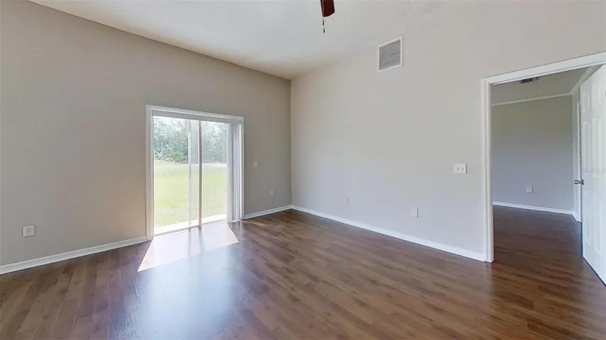 Family room area with sliding doors leading to back yard.