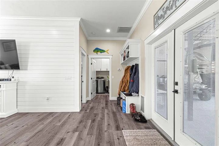 French doors provide access to the carport