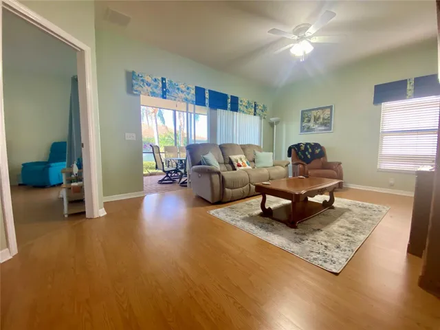 Living room with triple sliders to lanai