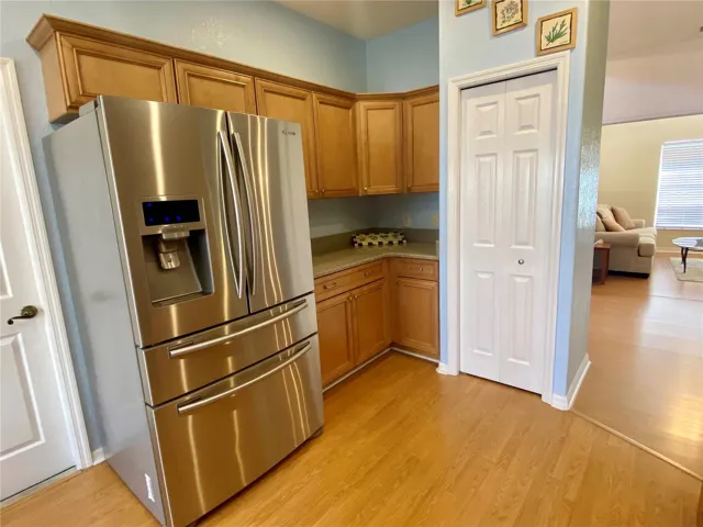 More cabinets, pantry, counter space and Stainless steel refrigerator with french doors