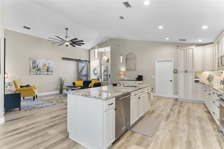 Massive island with granite counter, European style adjustable/expandable  kitchen faucet