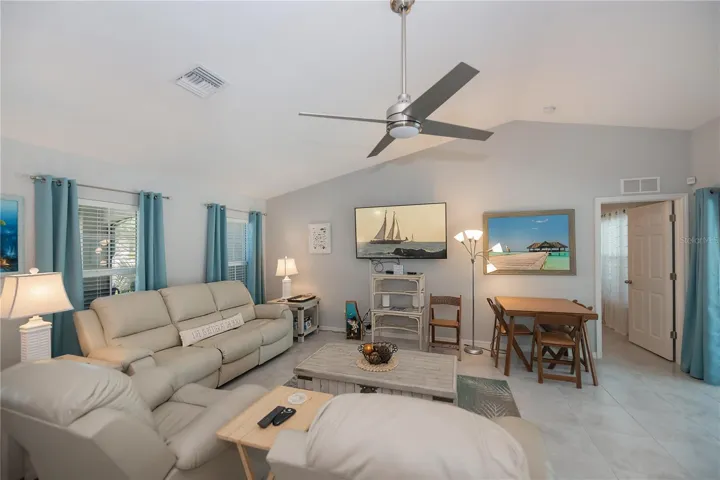 Great room with cathedral ceiling. Tile flooring throughout.