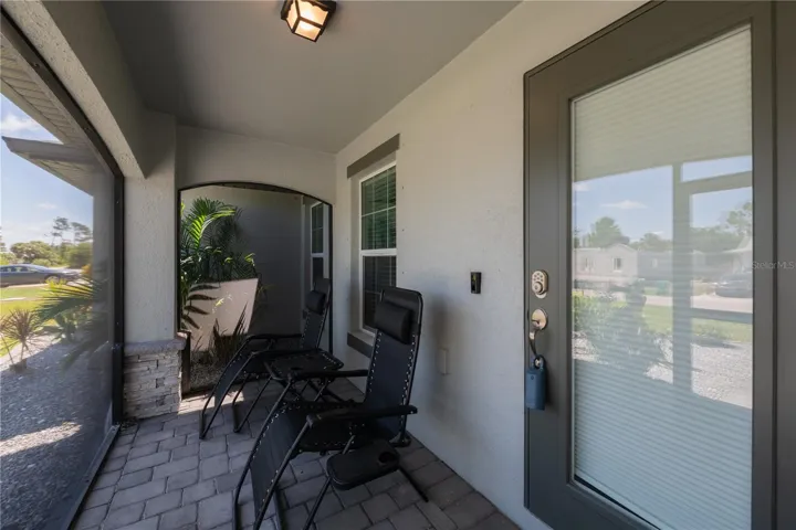 Inviting, screened front porch.