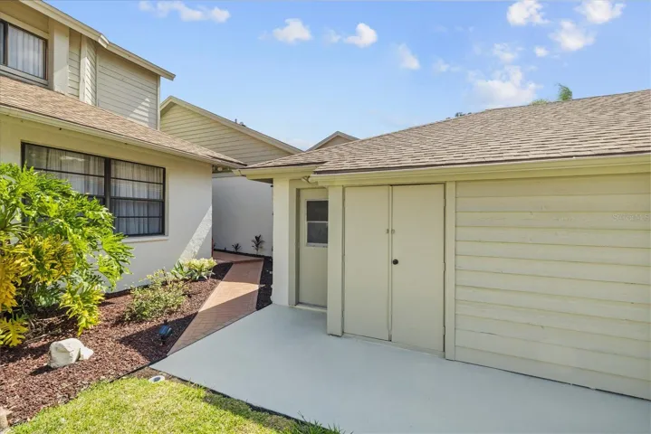 Storage shed and side entrance to garage