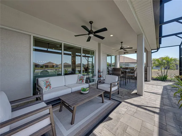Expanded, screened veranda with outdoor kitchen