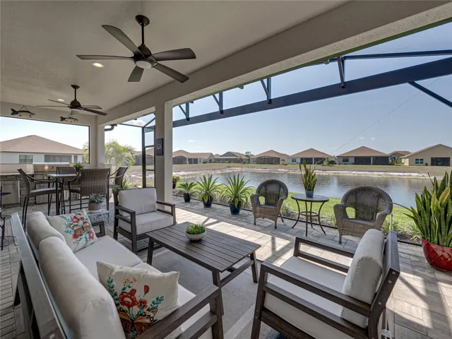 Expanded, screened veranda with outdoor kitchen