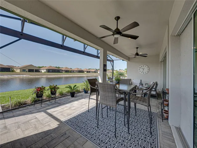 Expanded, screened veranda with outdoor kitchen