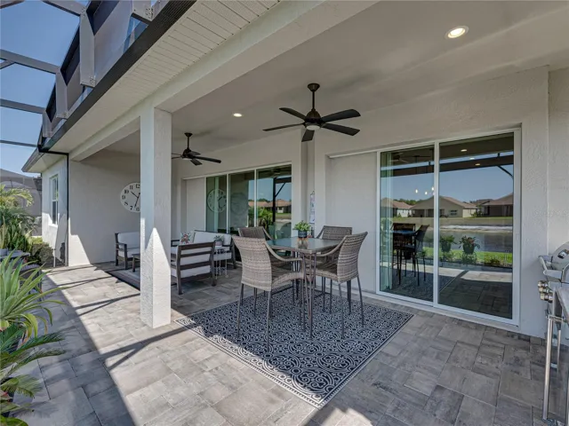 Expanded, screened veranda with outdoor kitchen