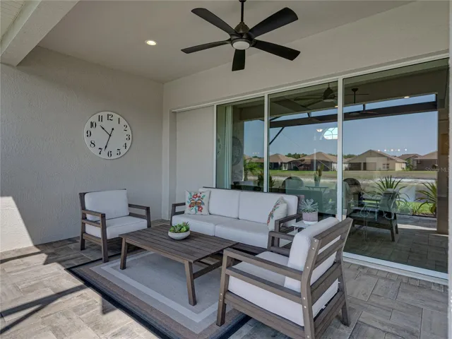 Expanded, screened veranda with outdoor kitchen
