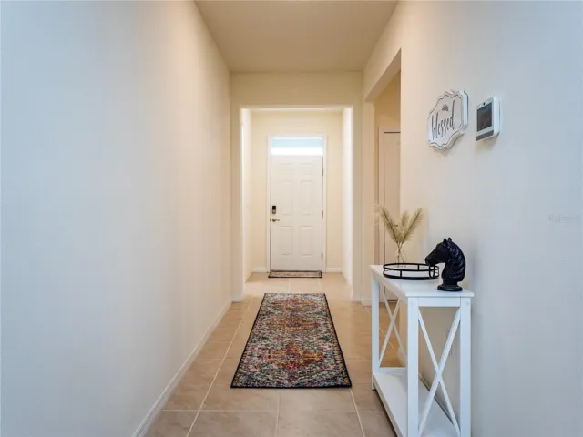 hall to secondary bedrooms, laundry and garage