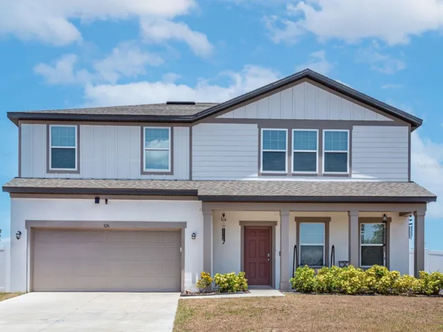 This family home has an oversized, covered front porch to welcome your guests and an abundance of entertaining space on the first floor.