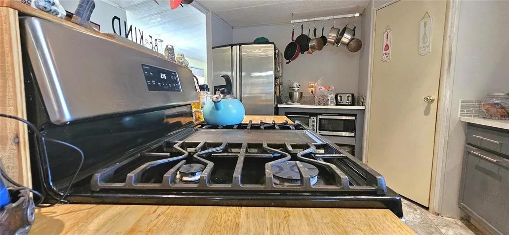 Kitchen includes walk-pantry, propane gas stove