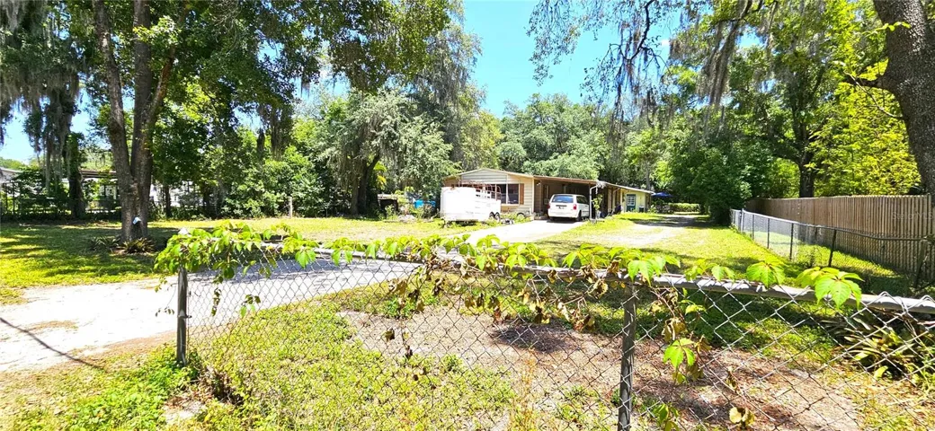 Main home 1380sf on half acre, well, septic, sewer, propane gas, electricity