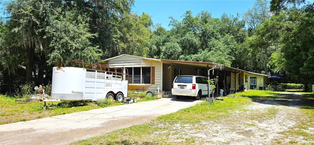 Main home 1380sf on half acre, well, septic, sewer, propane gas, electricity
