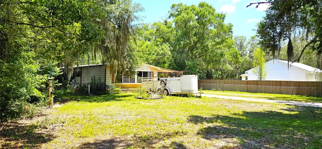Main home 1380sf on half acre, well, septic, sewer, propane gas, electricity
