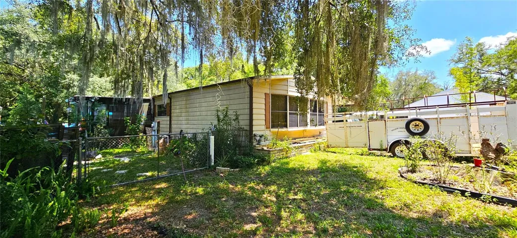 Main home 1380sf on half acre, well, septic, sewer, propane gas, electricity