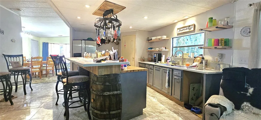 Kitchen includes walk-pantry, propane gas stove