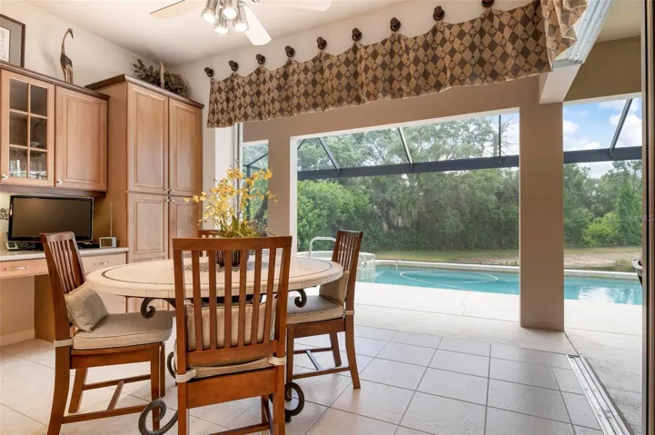 Dinette with pocket doors open to the pool