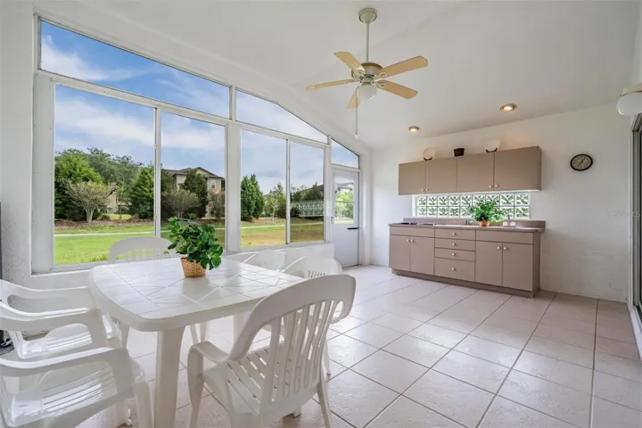 WOW! Lanai with a tiled floor, vaulted ceiling, built-ins and direct access to the backyard
