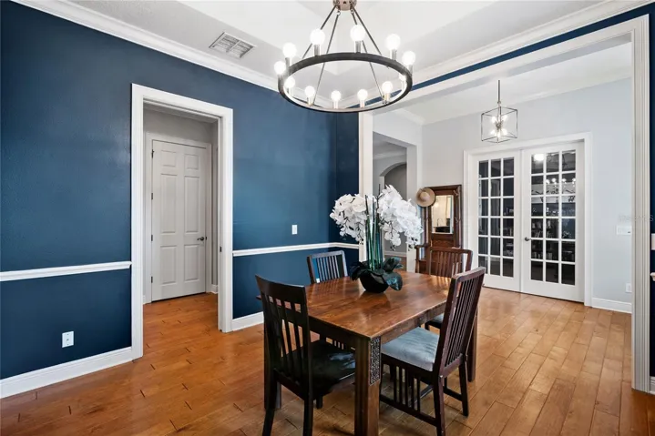 Dining Room with chair railing and crown molding.