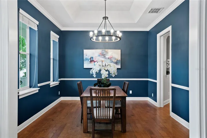 Dining Room with chair railing and crown molding.