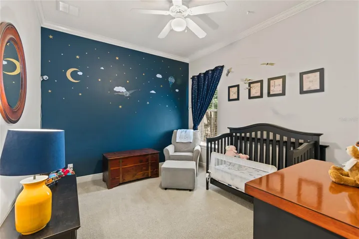 Bedroom 2 spacious with crown molding.