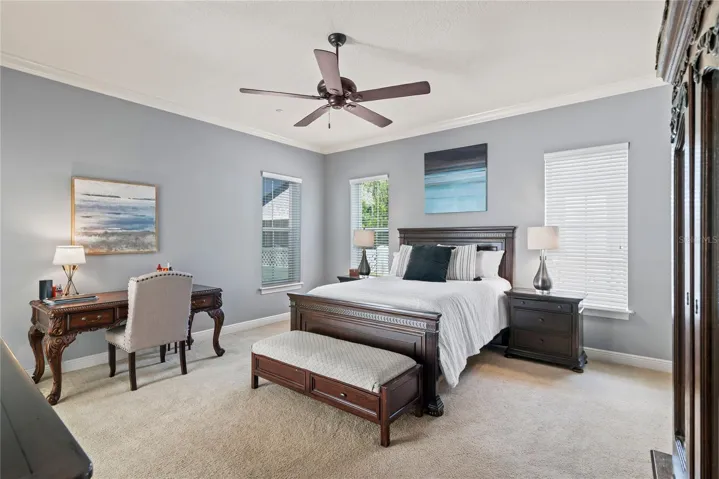 Large Primary Bedroom with Crown molding.
