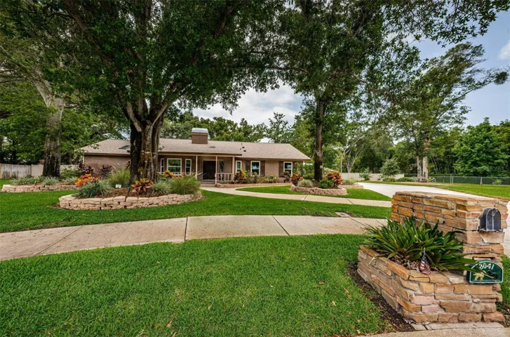 Lush landscaping and lovely shade trees