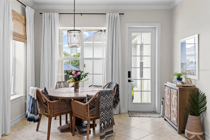 Lovely dinette area overlooks outdoor courtyard area