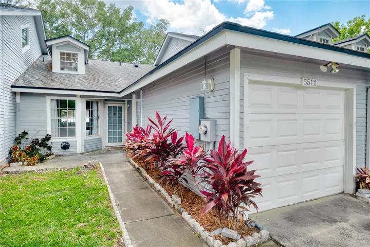 Fee-simple villa style townhome with a private one-car garage