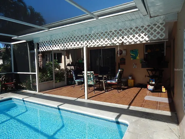 Tiled under roof lanai - Sliding Glass door to master bedroom