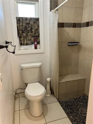 Primary shower stall with seat