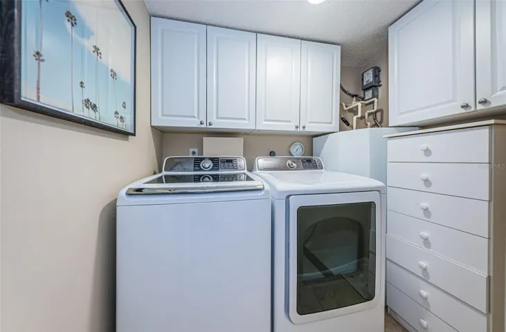 .. Inside Laundry by Unit Entrance..