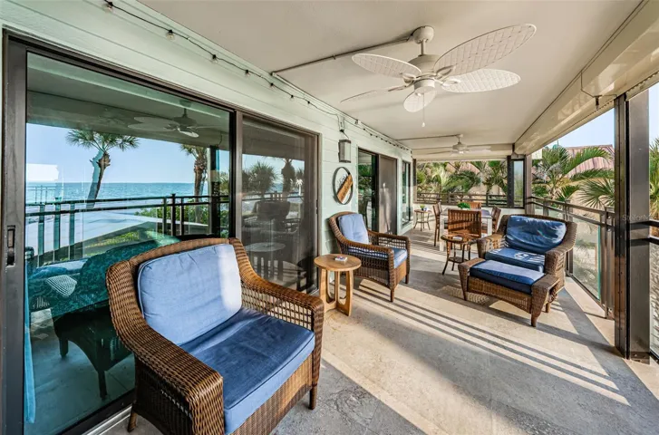 ... SLIDERS BY MASTER BEDROOM ACCESS...  27 X 10 Balcony Equipped With Electrical Storm Shutters. Perfect for Easy Shut Down..
