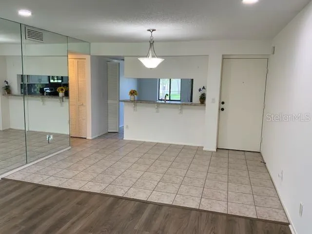 View from Living room toward Kitchen mirror left