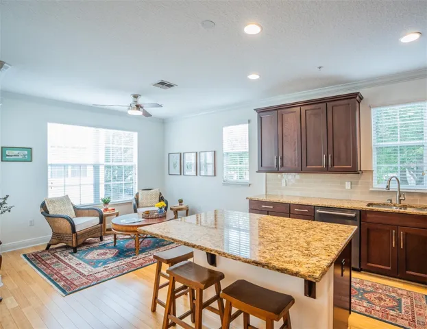 Huge Kitchen Flooded with Natural Light Featuring Island