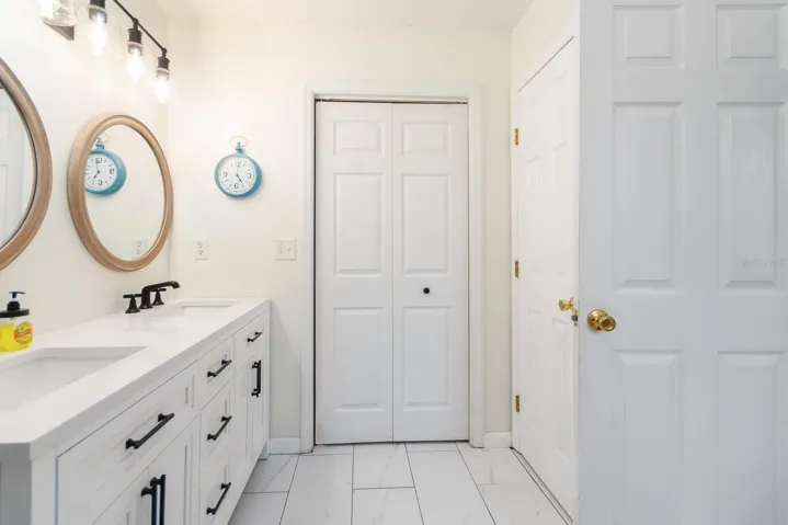 Primary Bathroom with door to walk-in closet