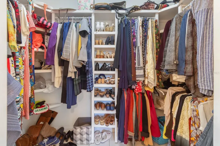 Walk-in closet with entrance in primary bathroom