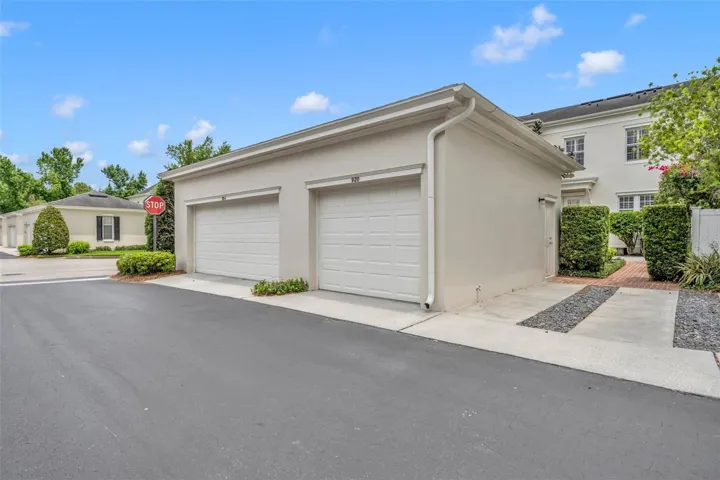 Parking pad next to garage space that belongs to this home.